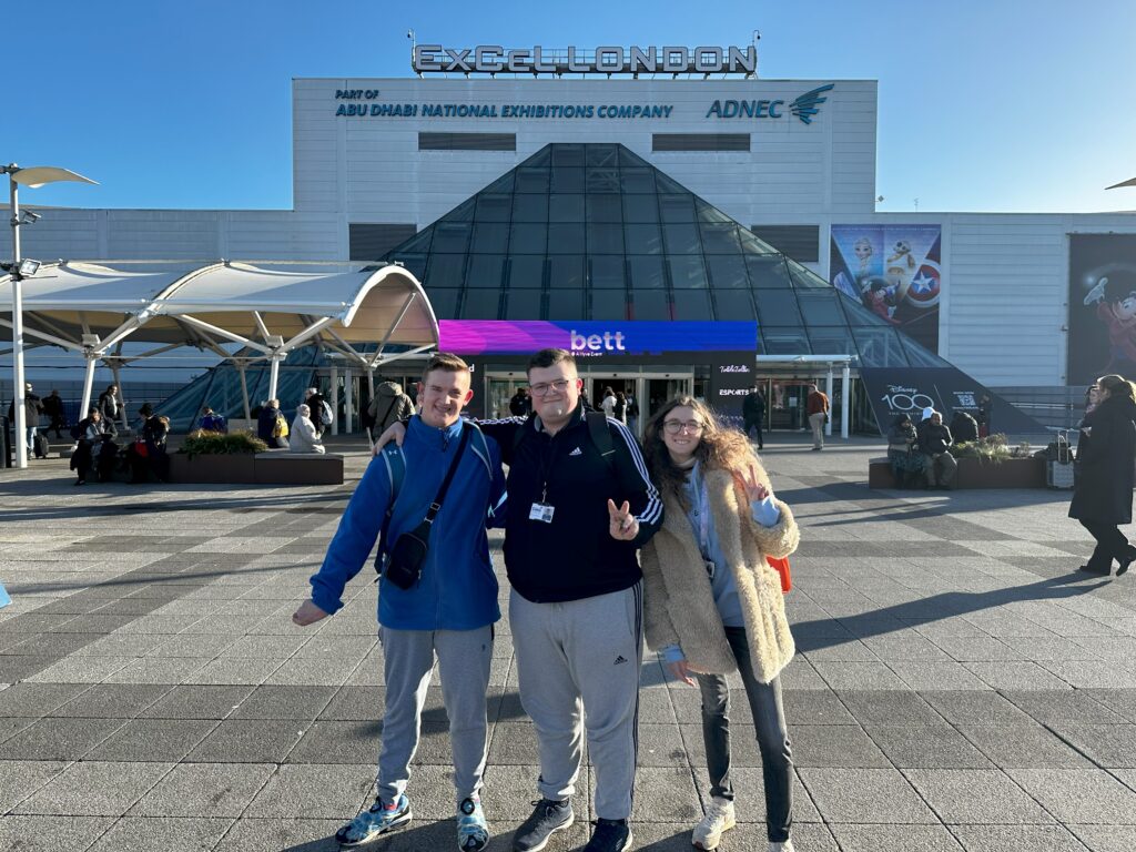 A group of three learners outside the Bett convention.
